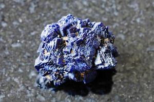 unpolished Azurite mineral crystals on black photo