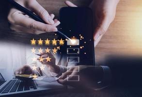Customer evaluation feedback.men in suit Giving Positive Review for Client's Satisfaction Surveys.giving a five star rating. Service rating, satisfaction concept photo