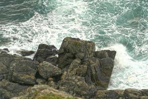 landscape with steep cliffs by the sea photo