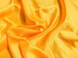 Minimal yellow fabric texture background. smooth elegant wavy light with cpoy space photo