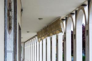 Tresigallo,Italy-may 2, 2021-detail of the porch in Tresigallo during a cloudy day photo