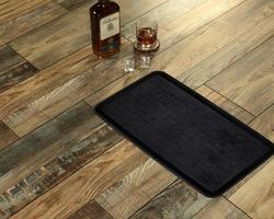 New Delhi, Delhi, IN, 2022 - Classic Black Textured Rounded Corner rectangle Door mat placed with Whiskey and Glass photo