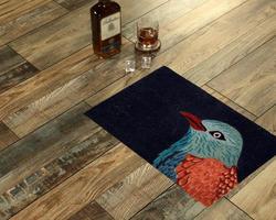 New Delhi, Delhi, IN, 2022 - Modern Black Kingfisher bird printed zute doormat placed with Whiskey and Glass photo