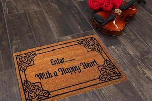 New Delhi, Delhi, IN, 2022 - Colorful Motif design Welcome zute doormat with Enter with a happy heart Text placed with Guitar and Red Roses photo