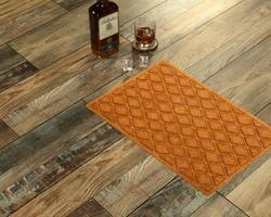 New Delhi, Delhi, IN, 2022 - Beautiful Beige color zig-zag patterned Welcome zute doormat with border placed with Whiskey and Glass photo