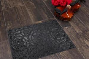New Delhi, Delhi, IN, 2022 - Beautiful Black Grey Sacred Pattern Rubber Glitter door mat placed on brown floor with Guitar photo