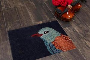 New Delhi, Delhi, IN, 2022 - Modern Black Kingfisher bird printed zute doormat placed on brown floor with Guitar photo
