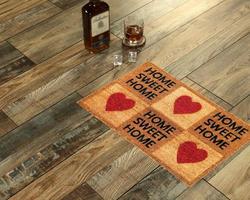 New Delhi, Delhi, IN, 2022 - Beautiful Home sweet home peach color coir doormat with hearts placed with Whiskey and Glass photo