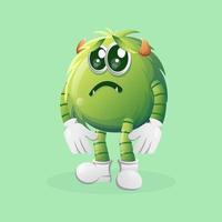 Cute green monster with sad expression vector