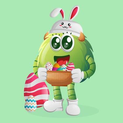 Cute green monster wearing the bunny cap with holding easter egg in basket