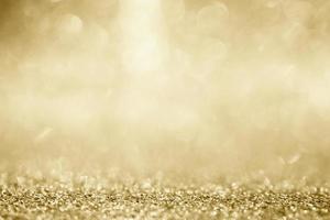 Abstract gold glitter sparkle blurred with bokeh background photo