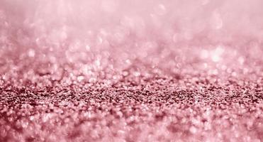 Abstract rose gold glitter sparkle texture with bokeh background photo