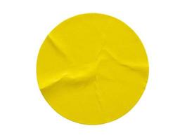 Yellow round paper sticker label isolated on white background photo