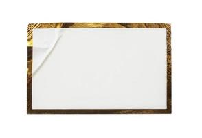 Blank white paper sticker label with golden frame isolated on white background photo