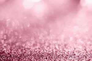 Abstract rose gold glitter sparkle texture with bokeh background photo