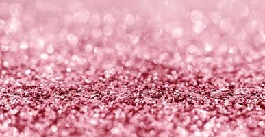 Abstract rose gold glitter sparkle texture with bokeh background photo