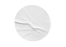 Blank white round paper sticker label isolated on white background photo