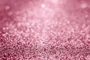 Abstract rose gold glitter sparkle texture with bokeh background photo