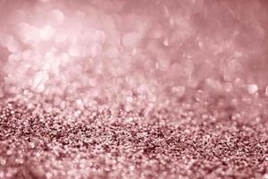 Abstract rose gold glitter sparkle texture with bokeh background photo