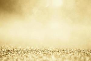 Abstract gold glitter sparkle blurred with bokeh background photo