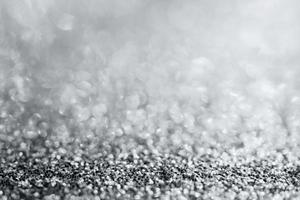 Abstract silver glitter sparkle texture with bokeh background photo