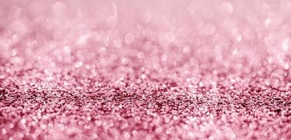 Abstract rose gold glitter sparkle texture with bokeh background photo