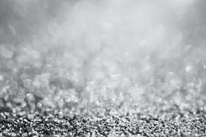 Abstract silver glitter sparkle texture with bokeh background photo