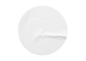 Blank white round paper sticker label isolated on white background photo