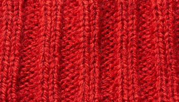 Fondo de textura de lana de punto rojo foto