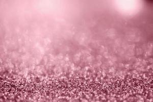 Abstract rose gold glitter sparkle texture with bokeh background photo