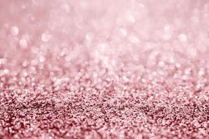 Abstract rose gold glitter sparkle texture with bokeh background photo