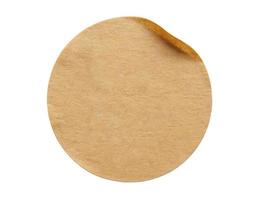 Brown round paper sticker label isolated on white background photo