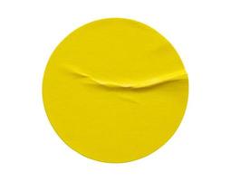 Yellow round paper sticker label isolated on white background photo