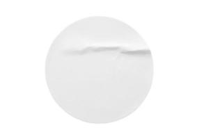 Blank white round paper sticker label isolated on white background photo