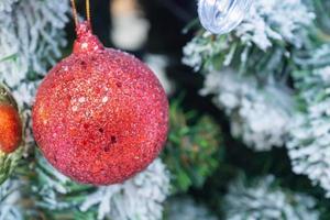 Decorated Christmas tree with red ball New Year holidays background photo