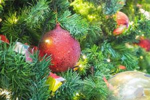 Decorated Christmas tree with red ball New Year holidays background photo
