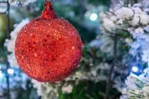 Decorated Christmas tree with red ball New Year holidays background photo