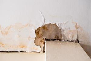 Water damaged ceiling roof, brown stain, office building photo