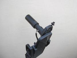 Attachment between monocular telescope and smartphone on a tripod photo