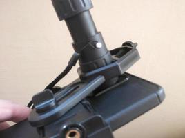 Attachment between monocular telescope and smartphone on a tripod photo