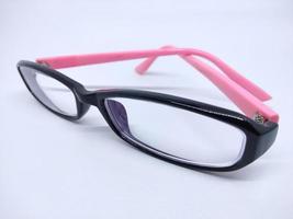 black and pink framed eye glasses. Isolated in white background. photo