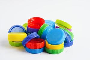 Plastic bottle caps colorful for recycle on white background. photo