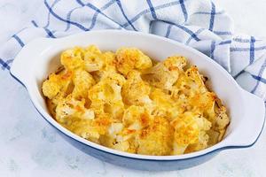 Diet food. Baked cauliflower with cheese, cream and eggs photo