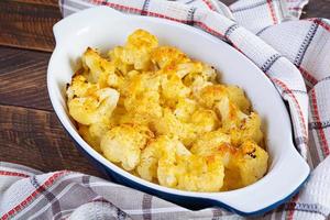 Diet food. Baked cauliflower with cheese, cream and eggs photo