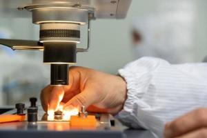 A closeup of the production and quality control of the internal parts of medical syringes photo