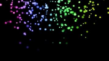 Mehrfarbige Partikel, die auf dem schwarzen Hintergrund leuchten. schwarzer Hintergrund mit hellen Partikeln auf dem Bildschirm.