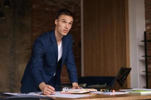 Business man working in office with laptop and documents on his desk, lawyer photo