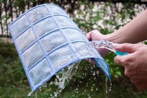 cleaning air conditioner dirty filter photo