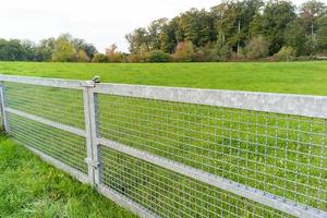 gate and fence on the field photo