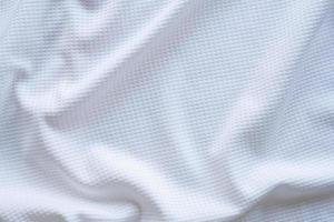 White sports clothing fabric football shirt jersey texture abstract background photo